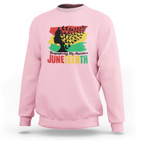 Light pink Juneteenth sweatshirt with multicolor ancestor silhouette and 'Juneteenth' text