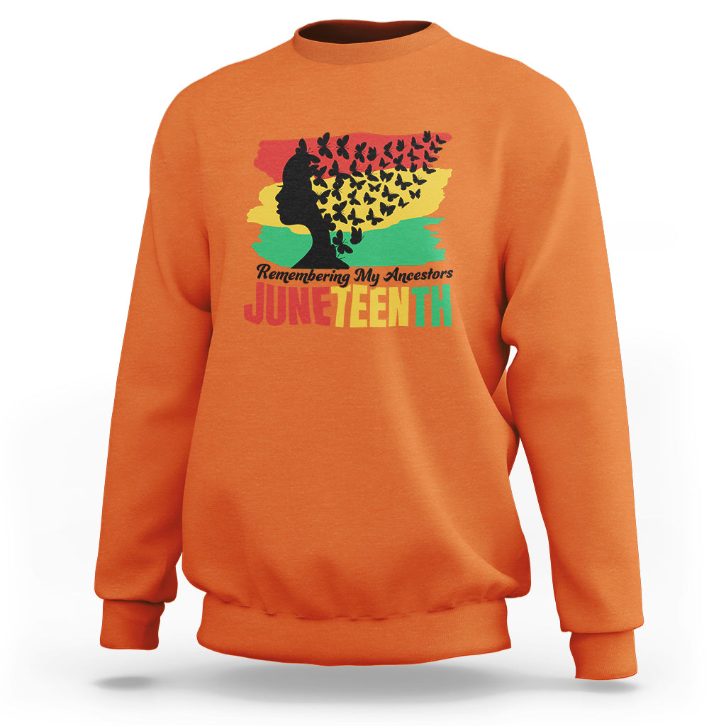 Orange Juneteenth sweatshirt with multicolor ancestor silhouette and 'Juneteenth' text