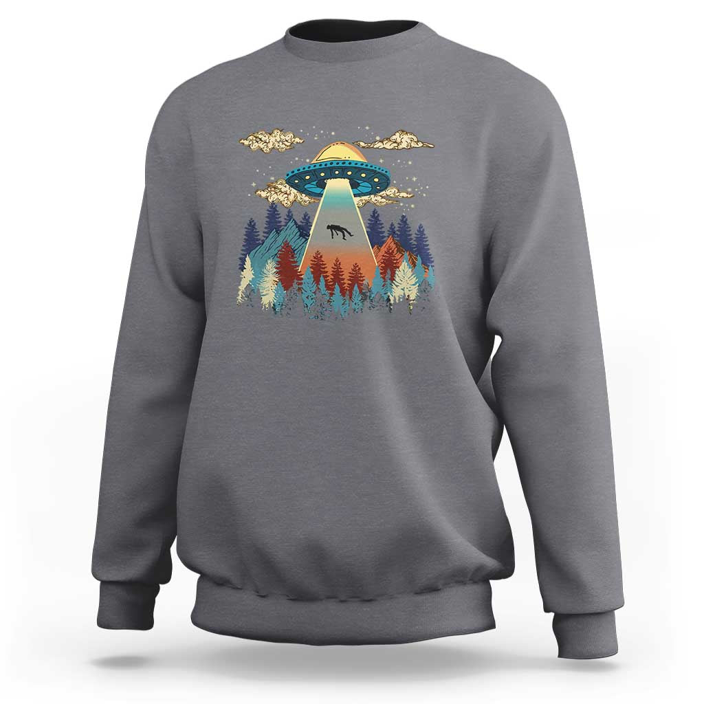 Charcoal crewneck sweatshirt with colorful UFO and pine forest graphic