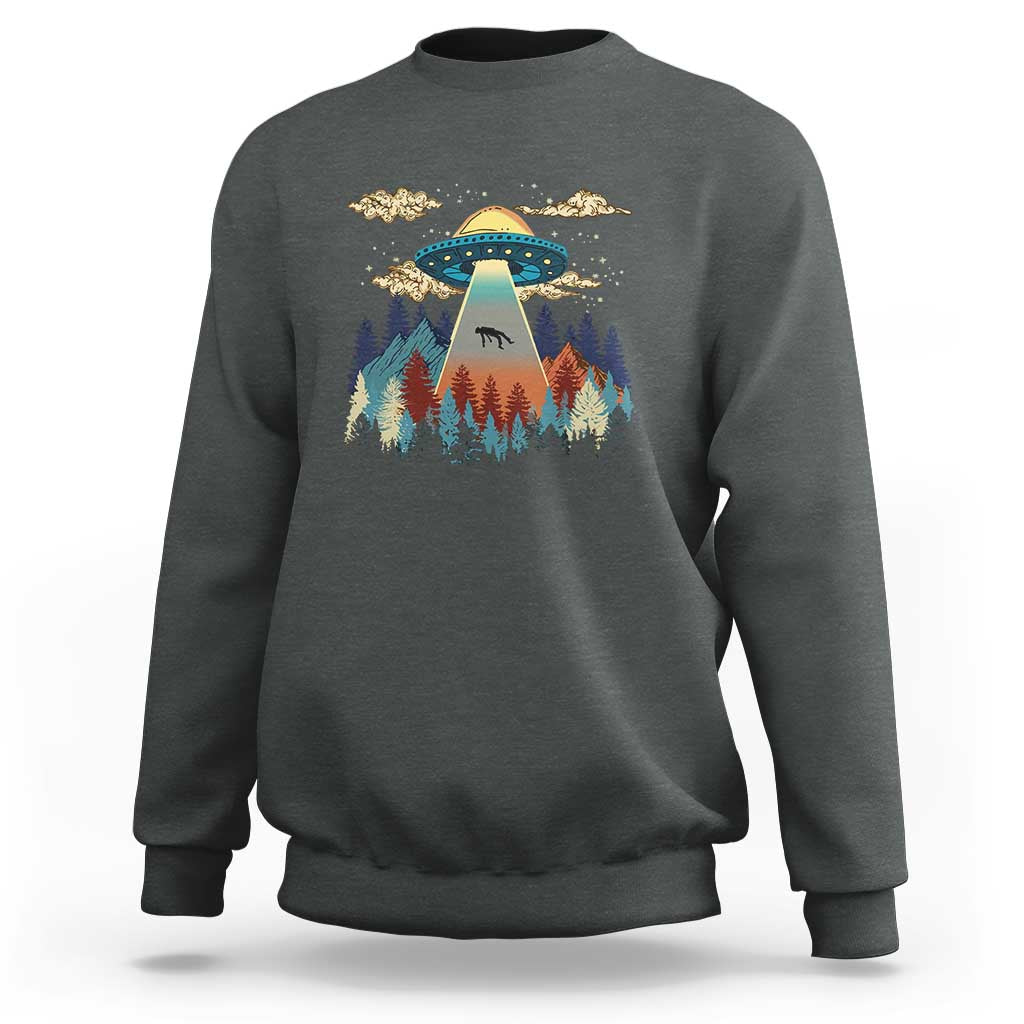 Dark heather gray crewneck sweatshirt with colorful UFO and pine forest graphic
