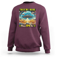 Maroon sweatshirt with centered UFO graphic and “World UFO Day” text on back