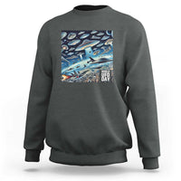 Graphic UFO sweatshirt with front rectangular "World UFO Day" print, dark heather gray.