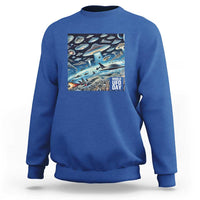 Graphic UFO sweatshirt with front rectangular "World UFO Day" print, royal blue.