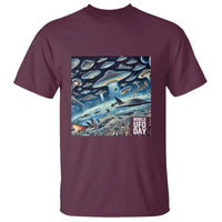Maroon T-shirt with colorful UFO scene and 'WORLD UFO DAY' print