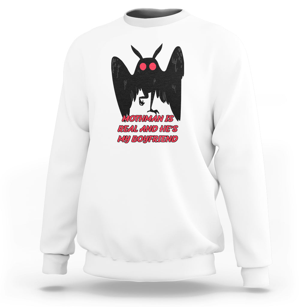 White sweatshirt with black mothman graphic and red text "MOTHMAN IS REAL"