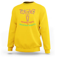 Daisy yellow crewneck sweatshirt with colorful holiday light graphic and text 'Holiday Lights & Abortion Rights'