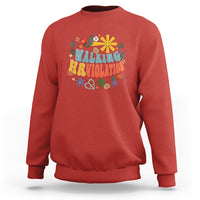 Red crewneck sweatshirt with “Walking Arriolation” colorful graphic on front