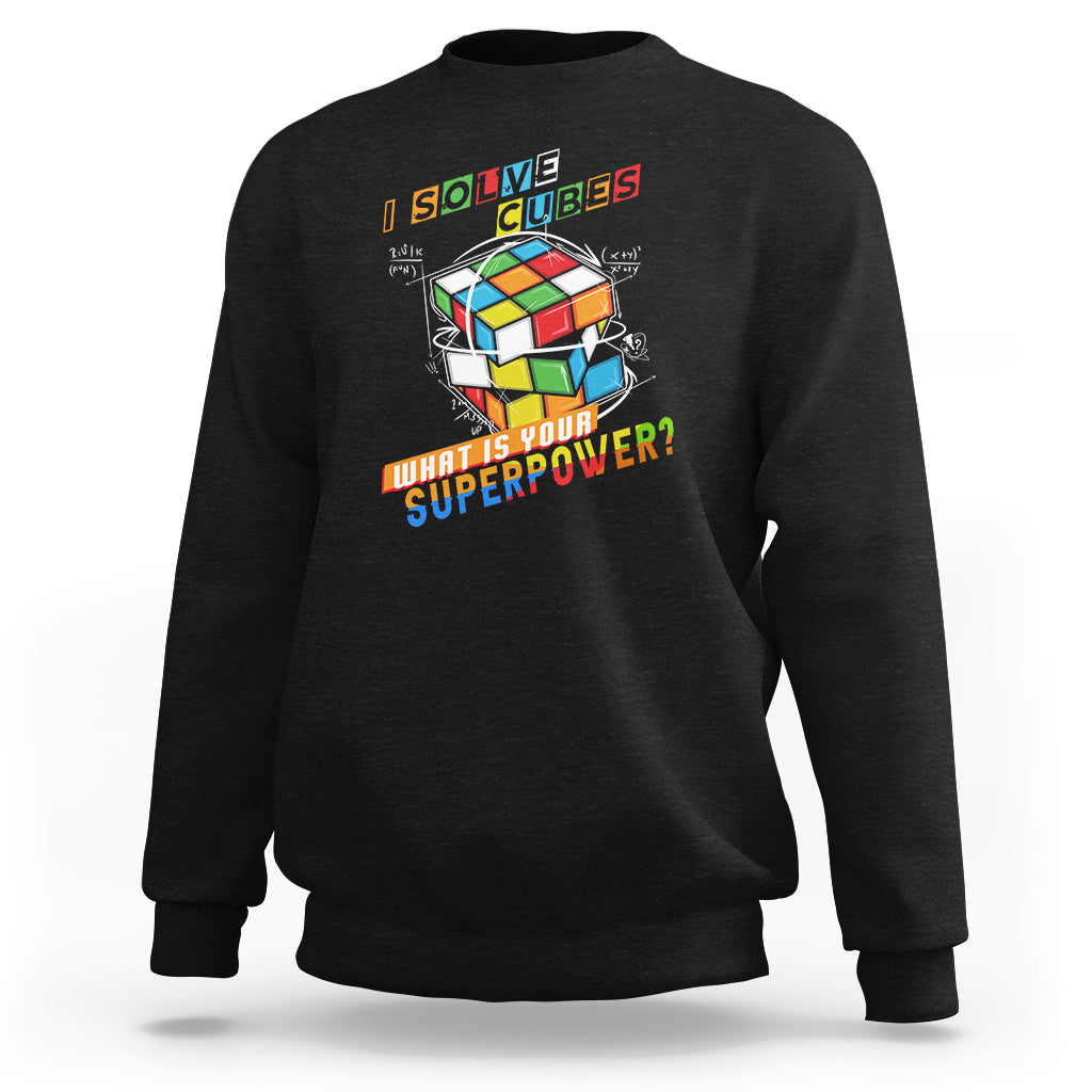 Black crewneck sweatshirt with colorful cube graphic and 'What is your superpower?' text