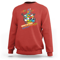 Red crewneck sweatshirt with colorful cube graphic and 'What is your superpower?' text