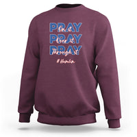Maroon sweatshirt with front prayer-themed graphic lettering and long sleeves