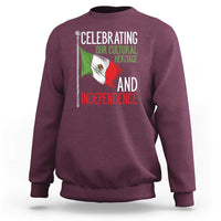 Maroon sweatshirt, back graphic with Mexican flag and text “Celebrating…Independence”