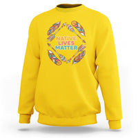 Daisy yellow crewneck sweatshirt with Native Lives Matter feather wreath graphic