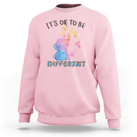 Autism support sweatshirt, light pink with watercolor elephant and “It’s ok to be different” text