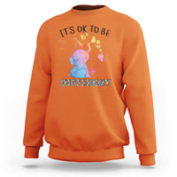 Autism support sweatshirt, orange with watercolor elephant and “It’s ok to be different” text