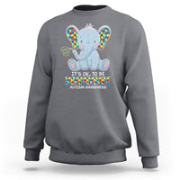 Charcoal gray sweatshirt with colorful autism awareness elephant graphic