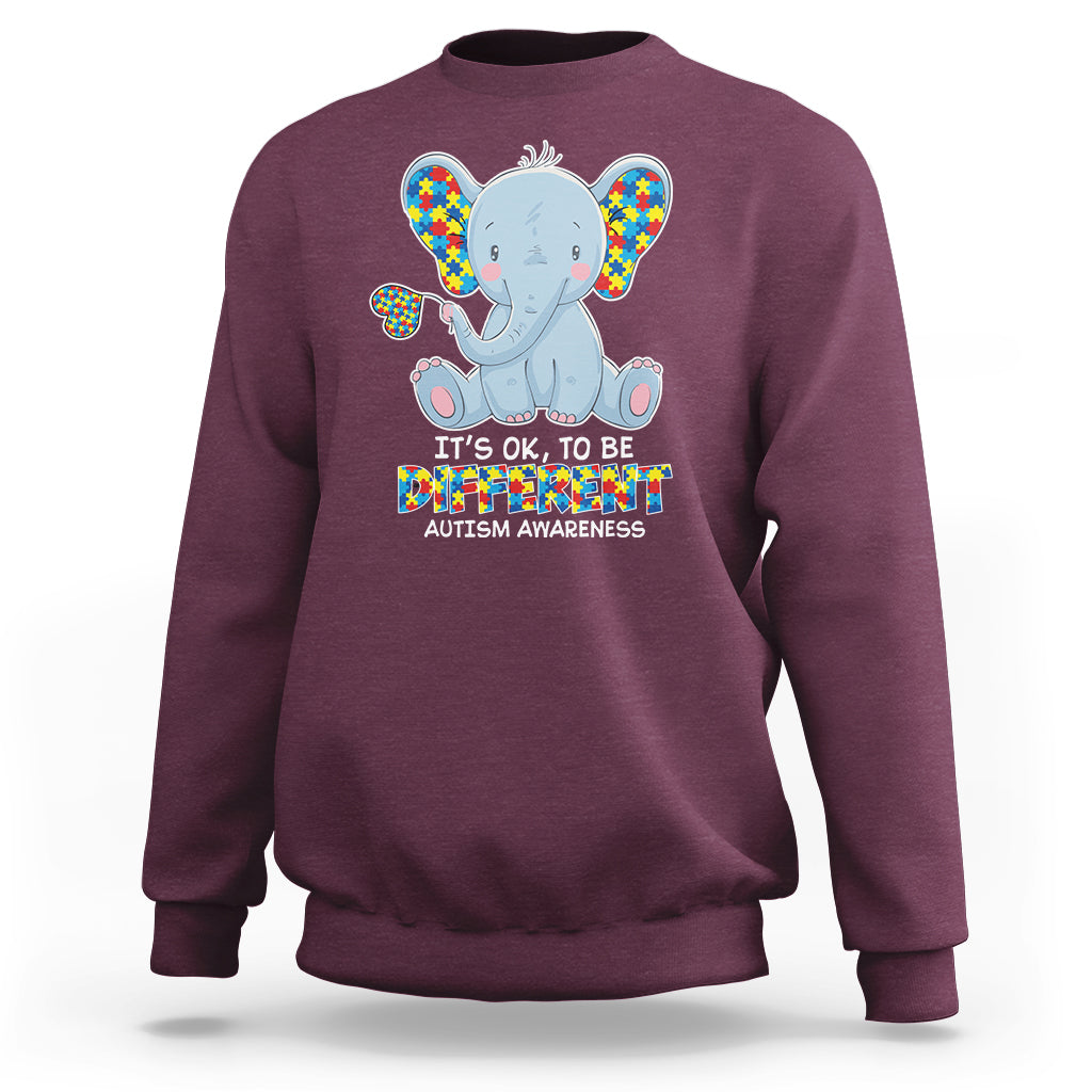 Maroon sweatshirt with colorful autism awareness elephant graphic