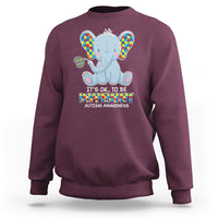 Maroon sweatshirt with colorful autism awareness elephant graphic
