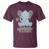 Maroon T-shirt with colorful autism awareness elephant graphic and text