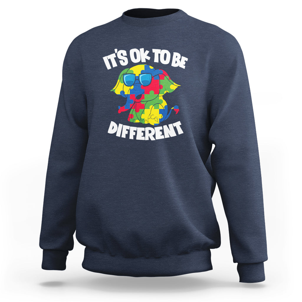Navy autism awareness sweatshirt with “It’s OK to be Different” elephant graphic.