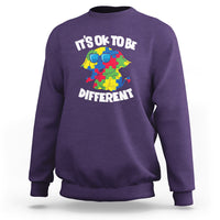 Purple autism awareness sweatshirt with “It’s OK to be Different” elephant graphic.