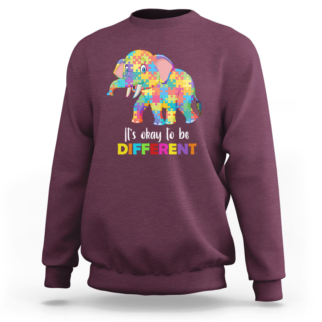 Autism sweatshirt with colorful elephant graphic, maroon crewneck