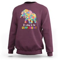 Autism sweatshirt with colorful elephant graphic, maroon crewneck