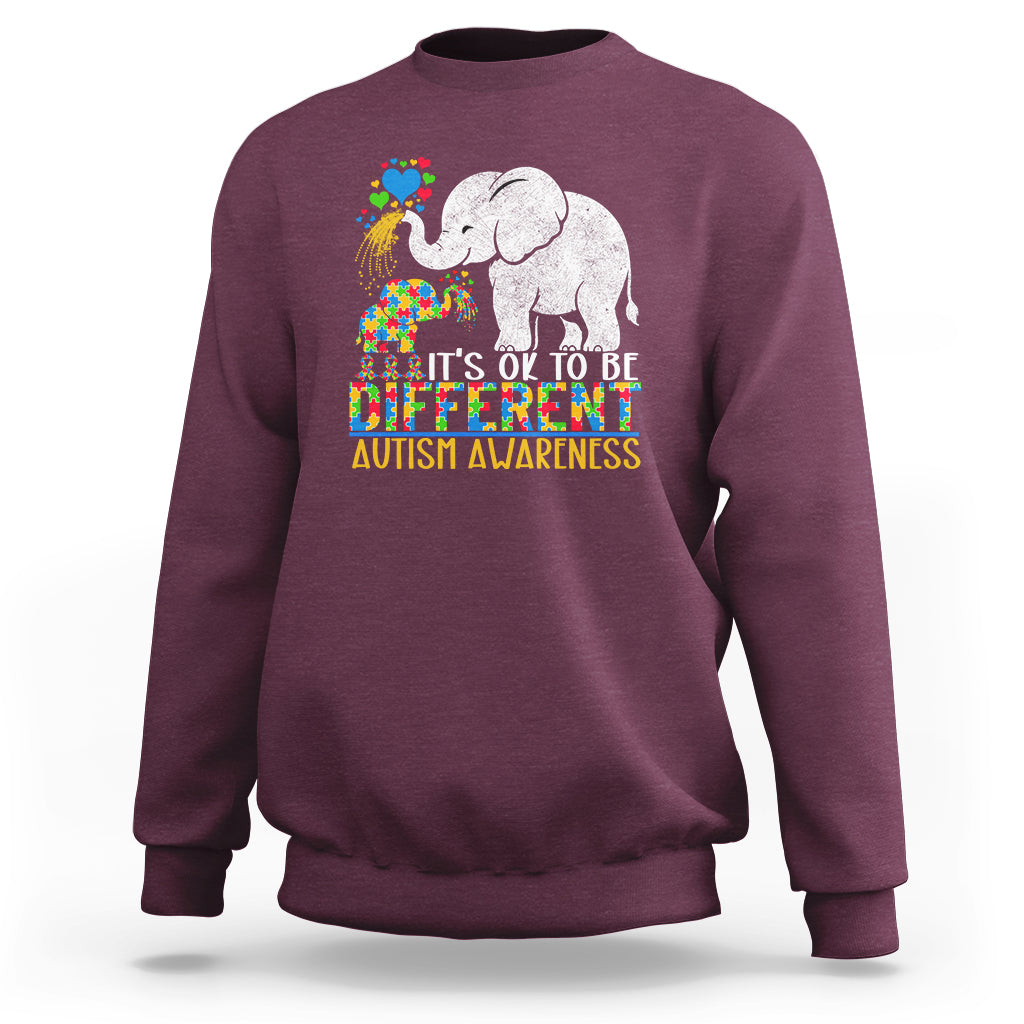Maroon crewneck sweatshirt with colorful elephant autism awareness graphic and slogan