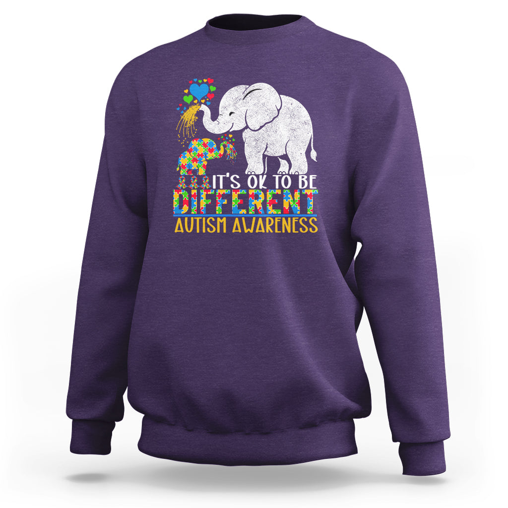Purple crewneck sweatshirt with colorful elephant autism awareness graphic and slogan