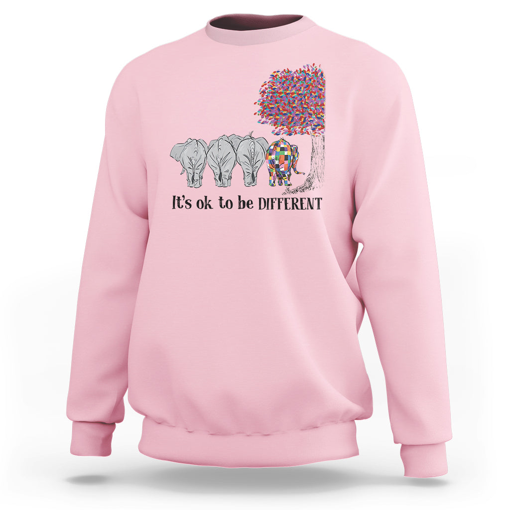 Light pink sweatshirt with elephant 'It's ok to be different' graphic
