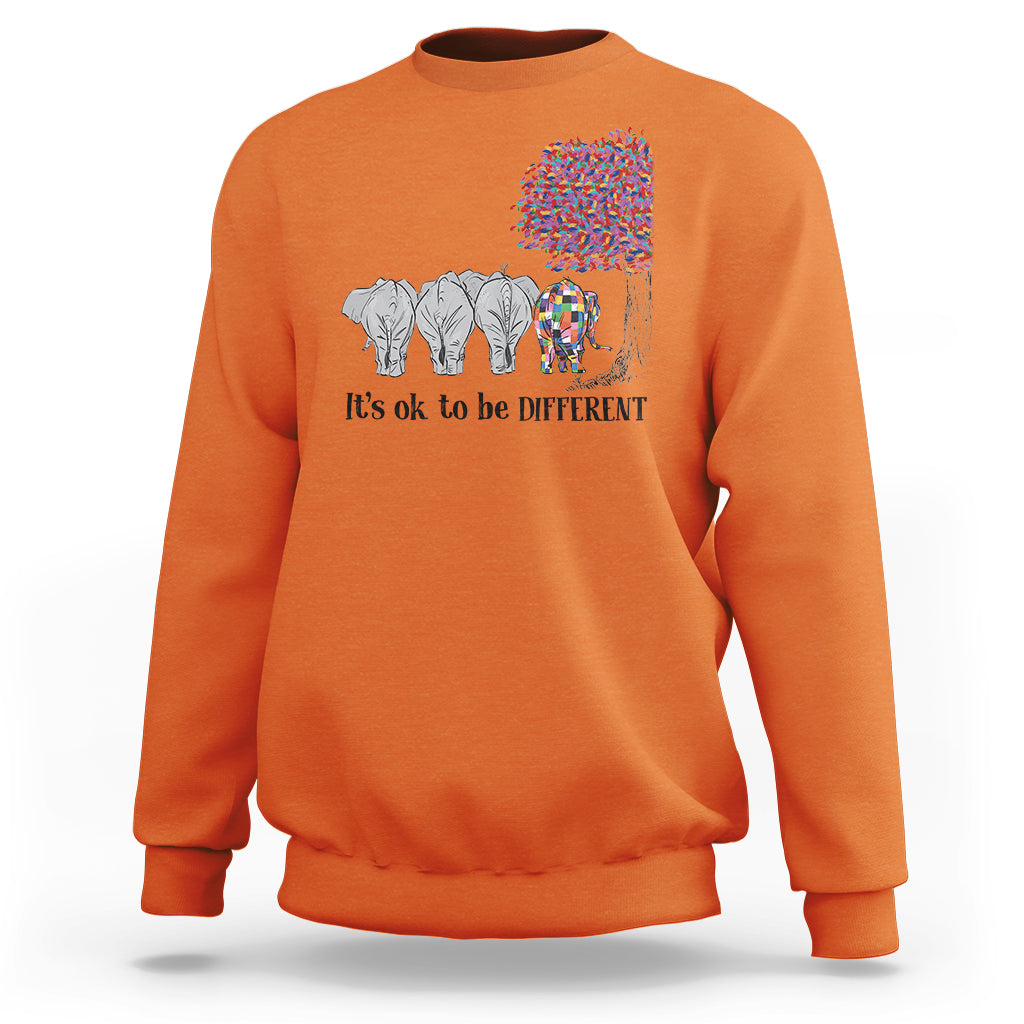 Orange sweatshirt with elephant 'It's ok to be different' graphic