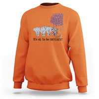 Orange sweatshirt with elephant 'It's ok to be different' graphic