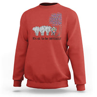 Red sweatshirt with elephant 'It's ok to be different' graphic