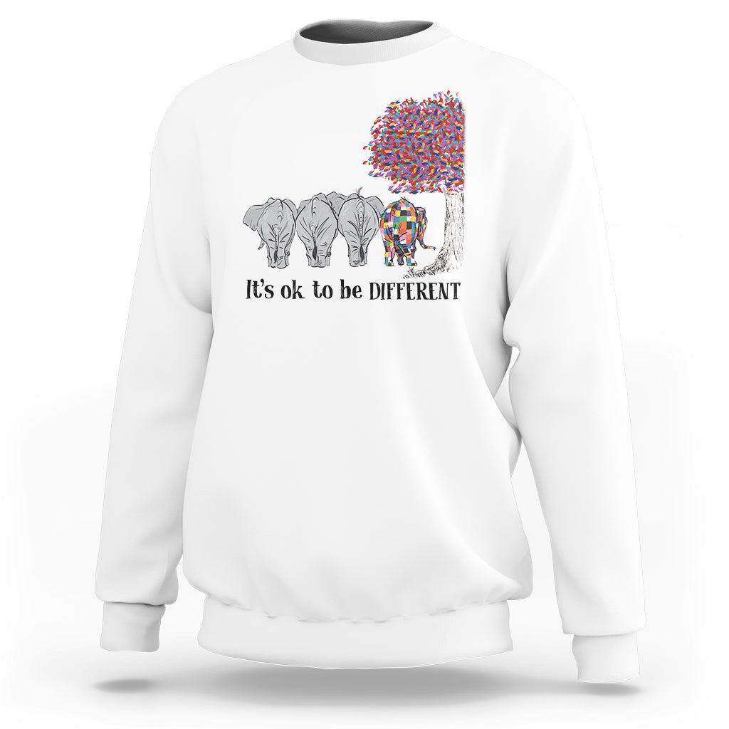 White sweatshirt with elephant 'It's ok to be different' graphic