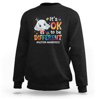 Black sweatshirt with cartoon elephant graphic and “It’s OK to be DIFFERENT” text