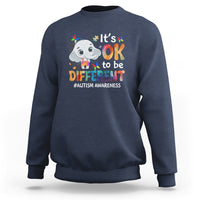 Navy sweatshirt with cartoon elephant graphic and “It’s OK to be DIFFERENT” text