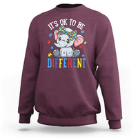 Maroon autism awareness sweatshirt with elephant “It's OK to be Different” graphic