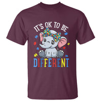 Maroon T-shirt with cartoon elephant and "It's OK TO BE DIFFERENT" slogan