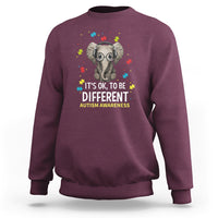 Maroon sweatshirt with autism elephant graphic and "It's OK, to be Different" text