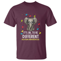 Maroon t-shirt with elephant puzzle graphic and "It's OK, to be Different" Autism awareness