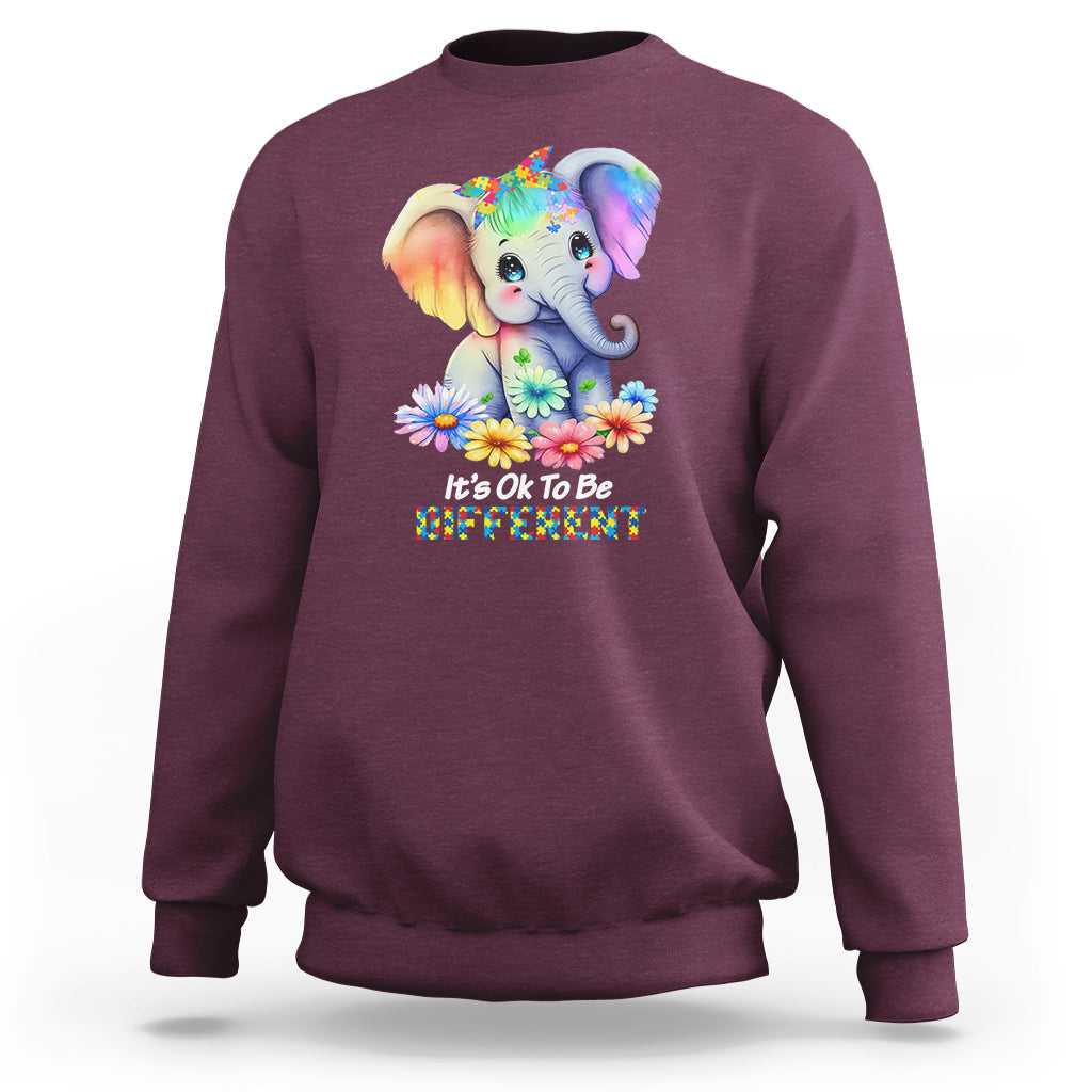 Maroon autism awareness sweatshirt with rainbow elephant and flower graphic