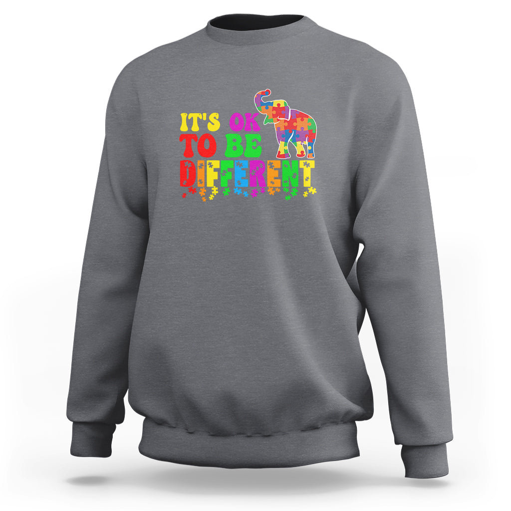 Light gray sweatshirt with colorful elephant and “It’s ok to be different” lettering