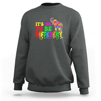 Heather gray sweatshirt with colorful elephant and “It’s ok to be different” text graphic
