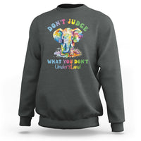 Dark heather gray sweatshirt with colorful elephant graphic and slogan 'DON'T JUDGE' on back.