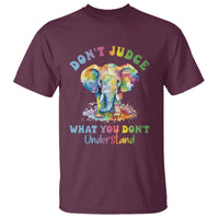 Maroon crew-neck T-shirt with colorful elephant graphic and 'Don't Judge' slogan