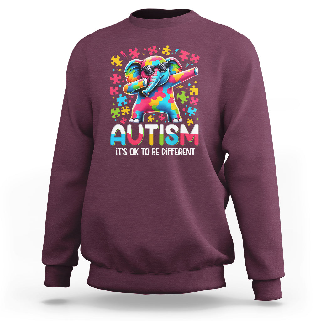 Maroon sweatshirt with rainbow dabbing elephant autism awareness graphic on front