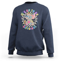 Navy crewneck sweatshirt with colorful elephant “It’s Okay To Be Different” graphic