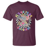 Autism support T-shirt, maroon, colorful elephant in checkered text graphic