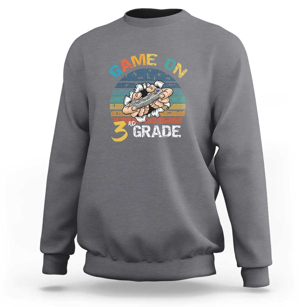 Gray sweatshirt with “GAME ON” and “3RD GRADE” gamer graphic on chest