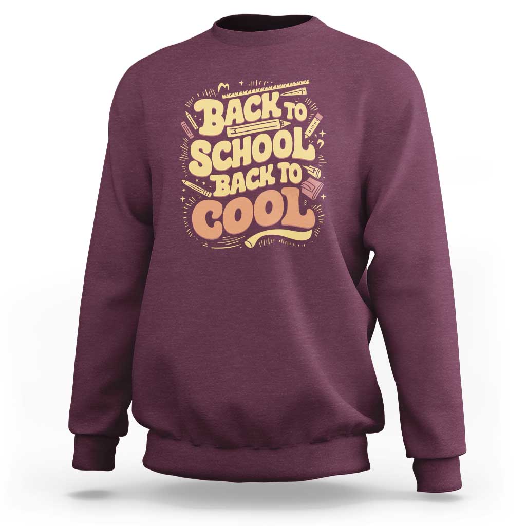 Back-to-school sweatshirt in maroon with 'Back to School Back to Cool' back graphic