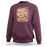 Back-to-school sweatshirt in maroon with 'Back to School Back to Cool' back graphic